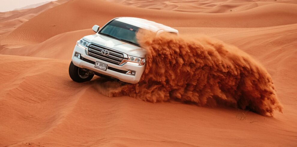 Evening Desert Safari in Dubai with camel rides, dune bashing, and BBQ dinner under the stars