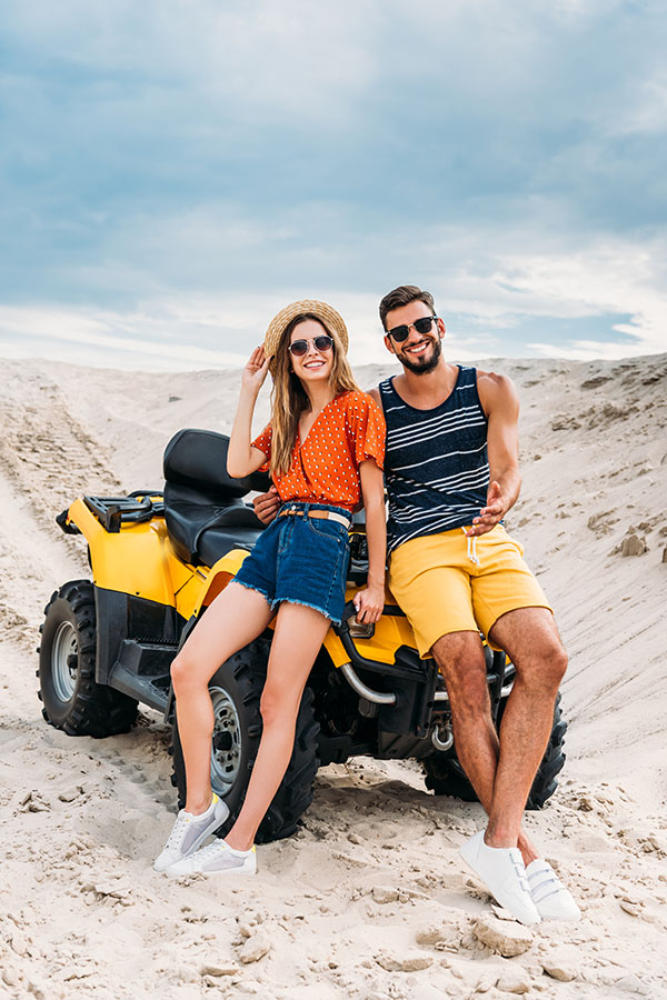 Couple having fun Adventure Tour with our Quad Bike Rides in Dubai Red Dunes