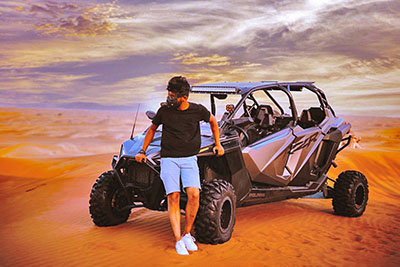 4 seater powerful desert buggy during romantic evening in red dunes of Dubai